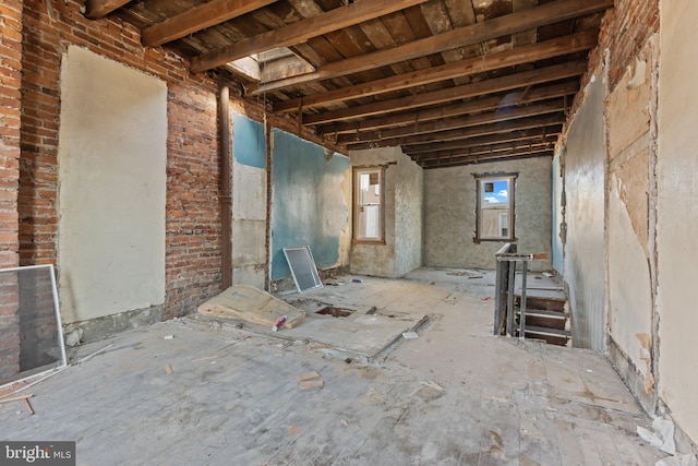 miscellaneous room featuring brick wall