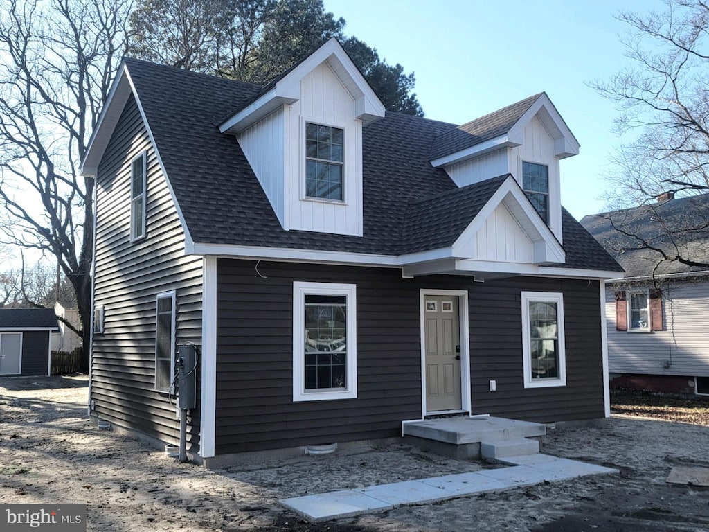 view of front of property with a shed