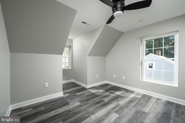 bonus room with vaulted ceiling, dark hardwood / wood-style floors, and ceiling fan