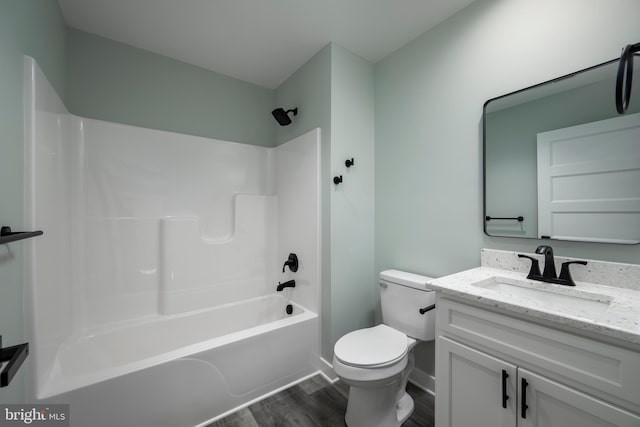 full bathroom with toilet, hardwood / wood-style flooring, shower / tub combination, and vanity