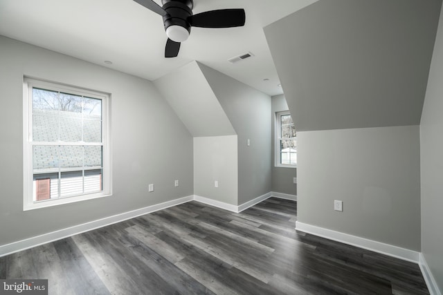 additional living space with lofted ceiling, ceiling fan, and dark hardwood / wood-style floors