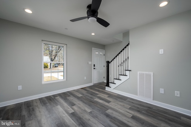 foyer entrance with ceiling fan and dark hardwood / wood-style flooring