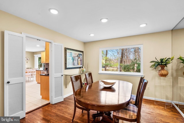 dining space featuring light wood-type flooring