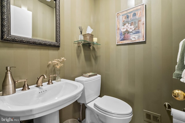 bathroom with sink and toilet