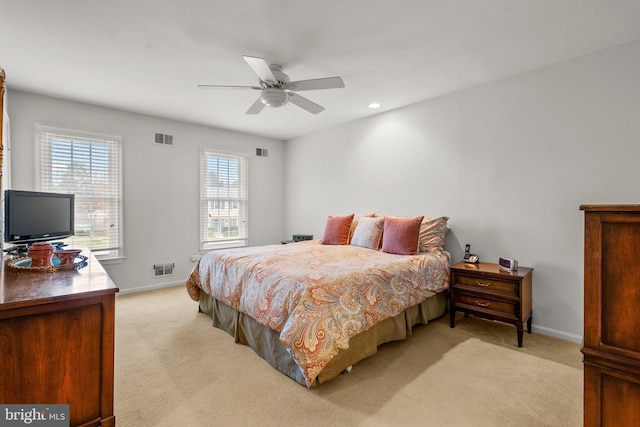 bedroom with light colored carpet and ceiling fan