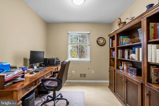 office space with light colored carpet