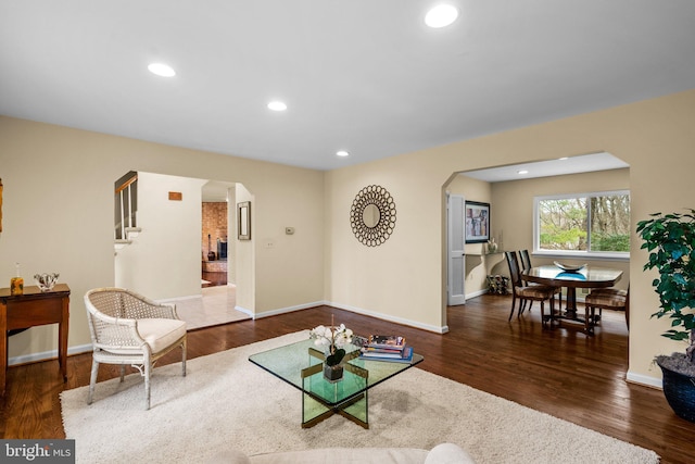 living room with dark hardwood / wood-style flooring