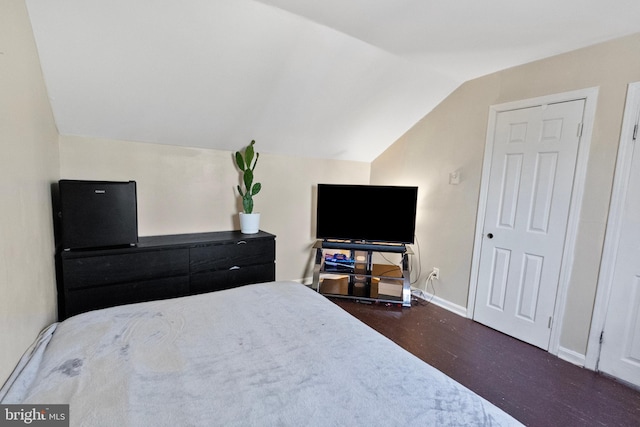 bedroom featuring lofted ceiling