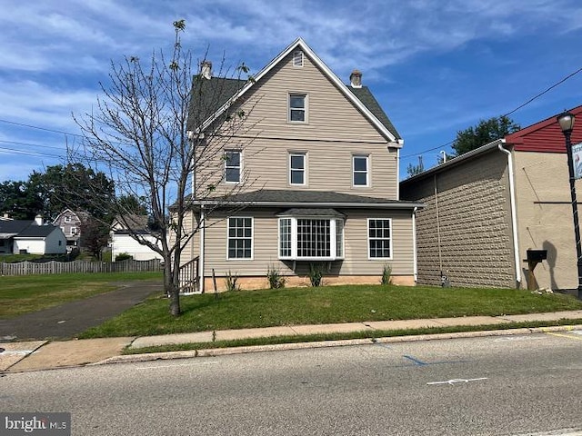 view of front property with a front lawn