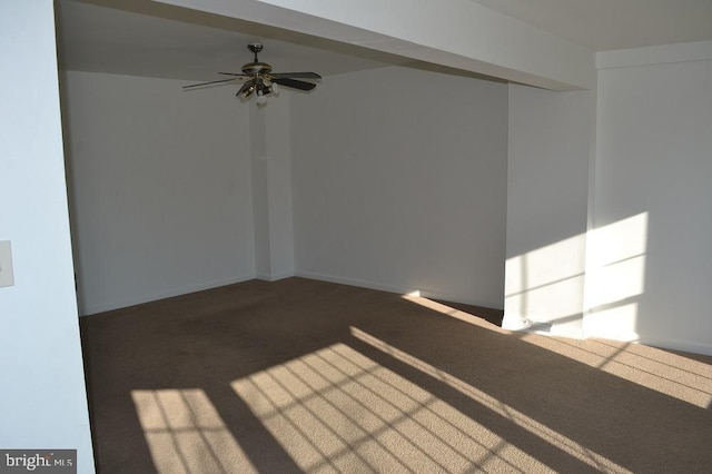 empty room featuring ceiling fan and carpet floors