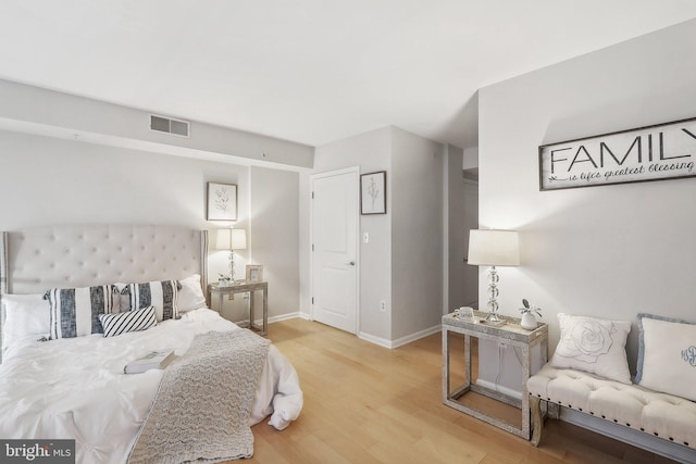 bedroom with hardwood / wood-style floors