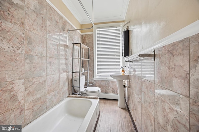 full bath with crown molding, tile walls, toilet, a baseboard heating unit, and wood finished floors