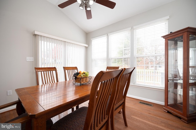 dining room featuring light hardwood / wood-style floors, ceiling fan, and lofted ceiling