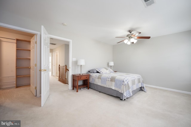 bedroom featuring ceiling fan and light colored carpet