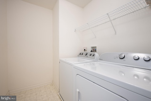 laundry area featuring washing machine and clothes dryer