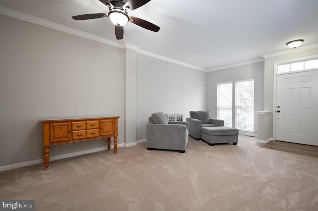 living area with light carpet, ceiling fan, and ornamental molding