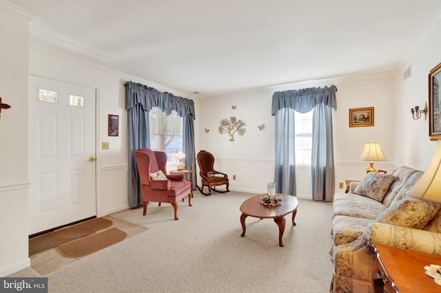 carpeted living room featuring ornamental molding