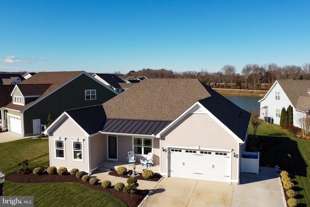 view of front of house with a garage, a front yard, and covered porch