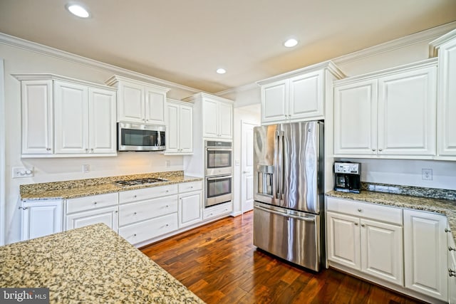 kitchen featuring white cabinetry, crown molding, dark hardwood / wood-style flooring, stainless steel appliances, and light stone countertops