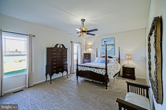 bedroom featuring light carpet and ceiling fan