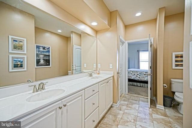 bathroom with vanity and toilet