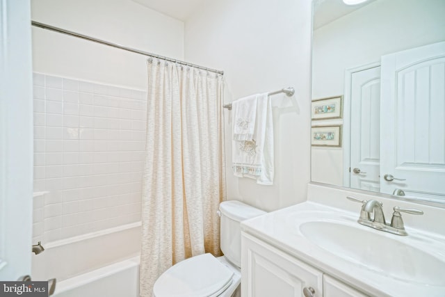 full bathroom with vanity, shower / bath combo, and toilet