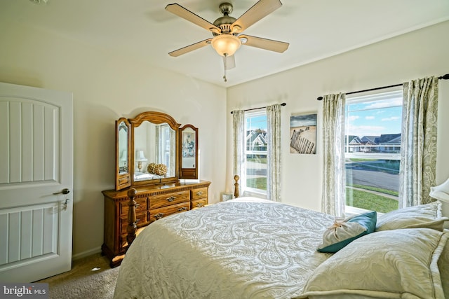 bedroom with ceiling fan and carpet flooring