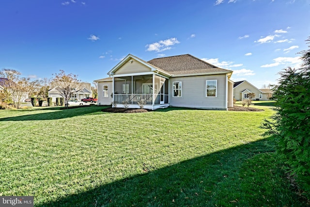 back of house with a porch and a yard