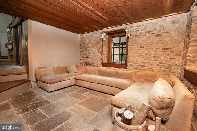 unfurnished living room with wooden ceiling and baseboard heating