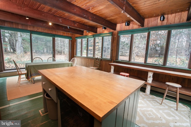 sunroom / solarium with beamed ceiling and wooden ceiling