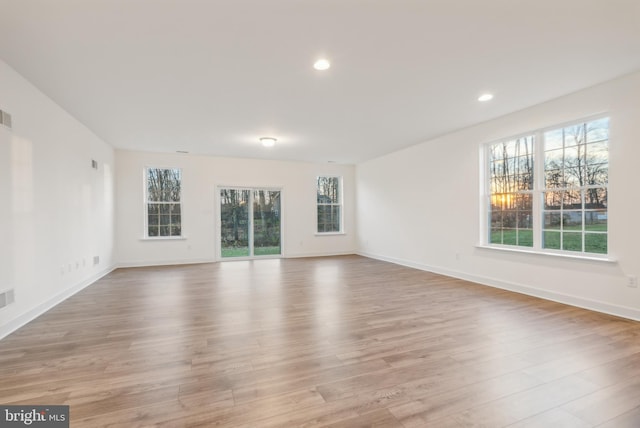 unfurnished room with light hardwood / wood-style flooring