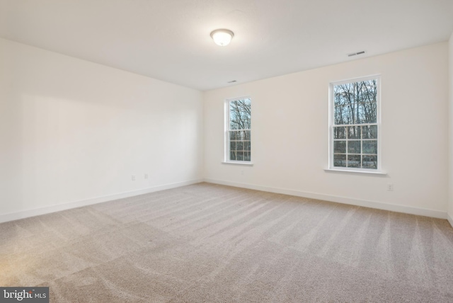 unfurnished room with carpet flooring