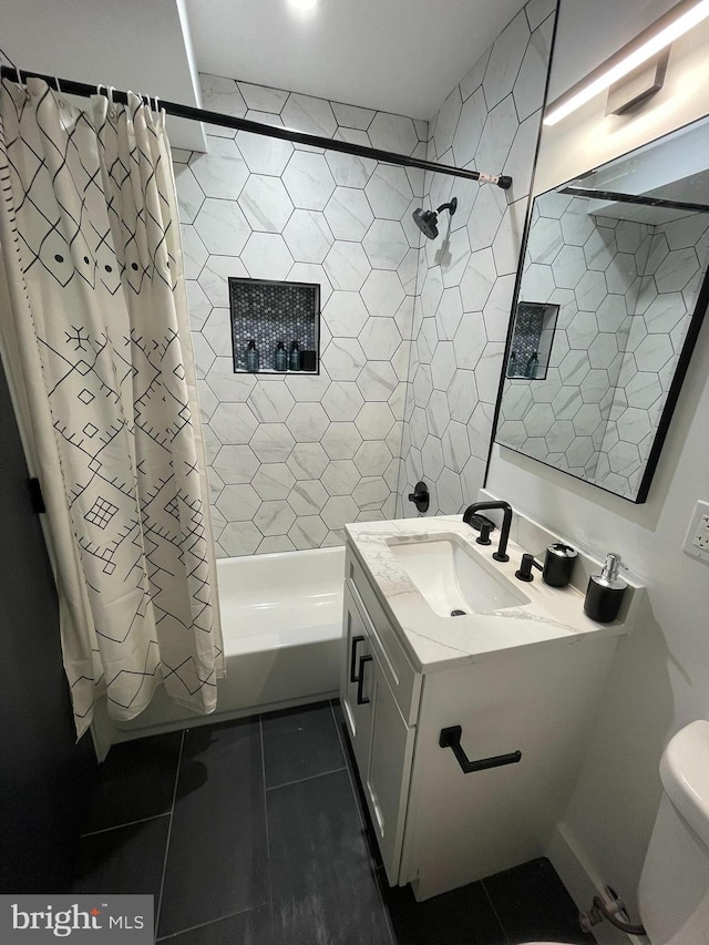 full bathroom featuring tile patterned floors, vanity, toilet, and shower / tub combo with curtain