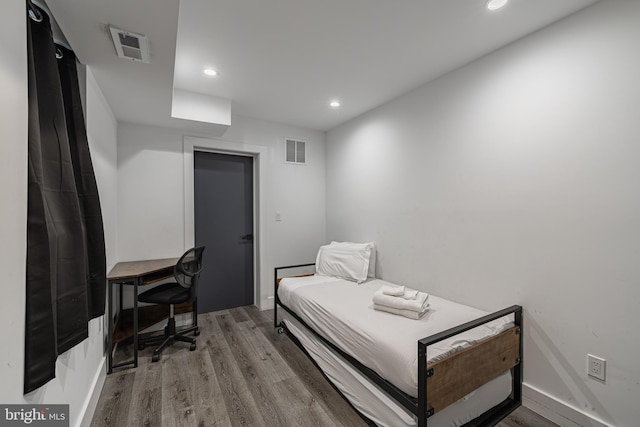 bedroom with hardwood / wood-style floors