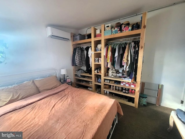 bedroom featuring a wall mounted air conditioner, carpet, and a closet