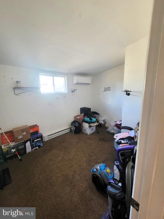 misc room featuring baseboard heating and a wall mounted AC