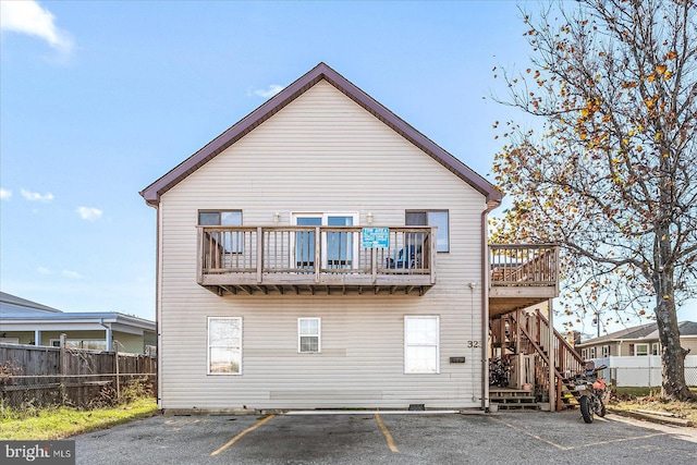 back of property with a balcony