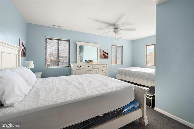 carpeted bedroom with ceiling fan