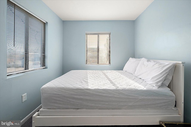 bedroom with multiple windows