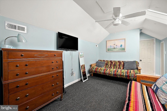 bedroom with ceiling fan, dark carpet, and vaulted ceiling