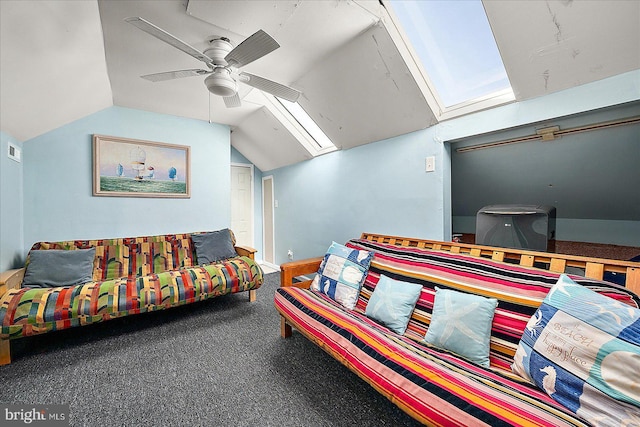 carpeted bedroom with lofted ceiling with skylight and ceiling fan