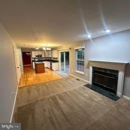 unfurnished living room featuring hardwood / wood-style flooring