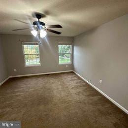 carpeted empty room featuring ceiling fan and a healthy amount of sunlight