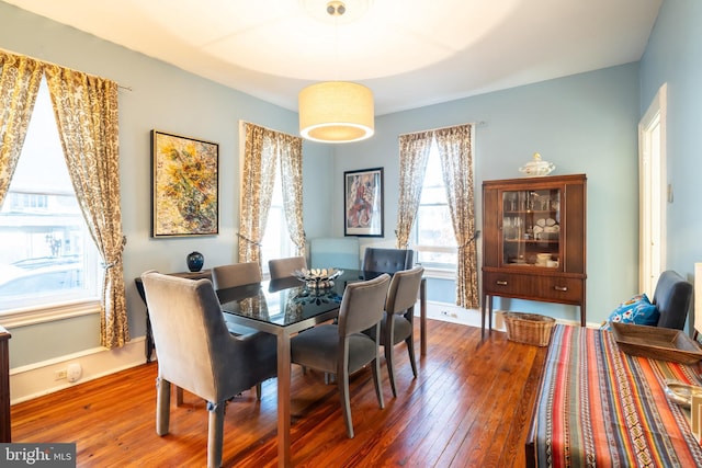 dining area featuring dark hardwood / wood-style floors