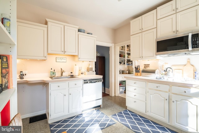 kitchen featuring white dishwasher and sink