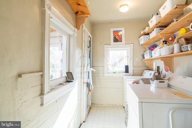 clothes washing area with washer and dryer