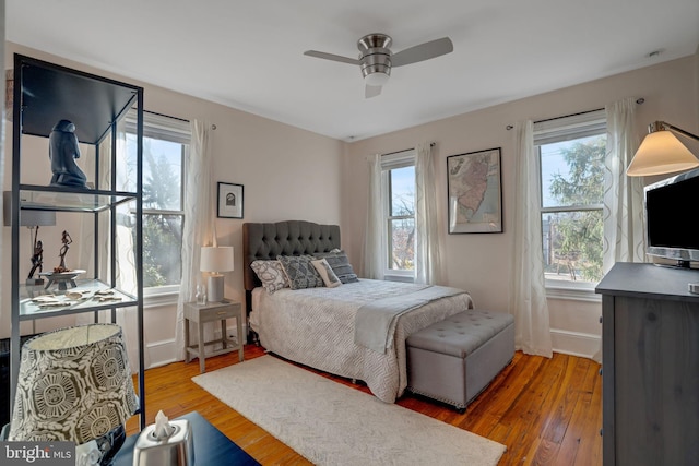 bedroom featuring hardwood / wood-style floors and ceiling fan