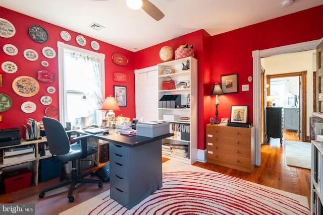 office featuring wood-type flooring and ceiling fan