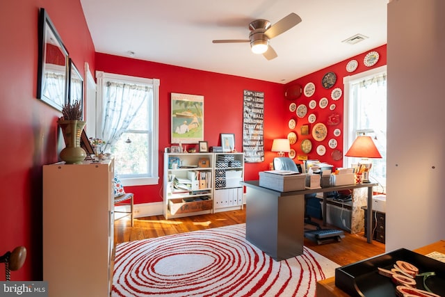 office area with ceiling fan, plenty of natural light, and hardwood / wood-style flooring