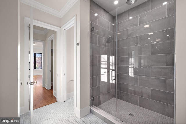 bathroom featuring crown molding, wood-type flooring, and walk in shower